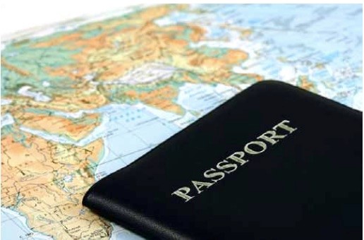 A passport lying on a world map