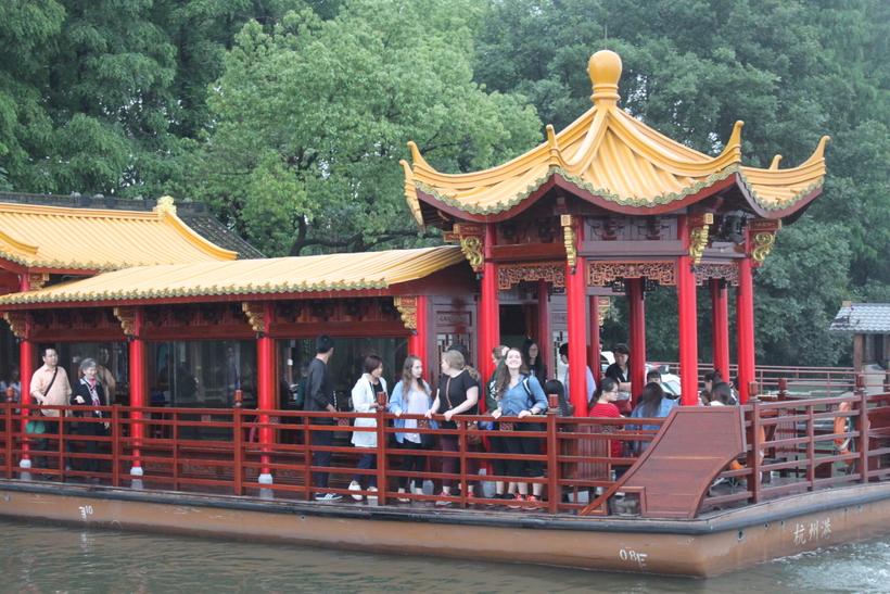 Students on a platform on the river