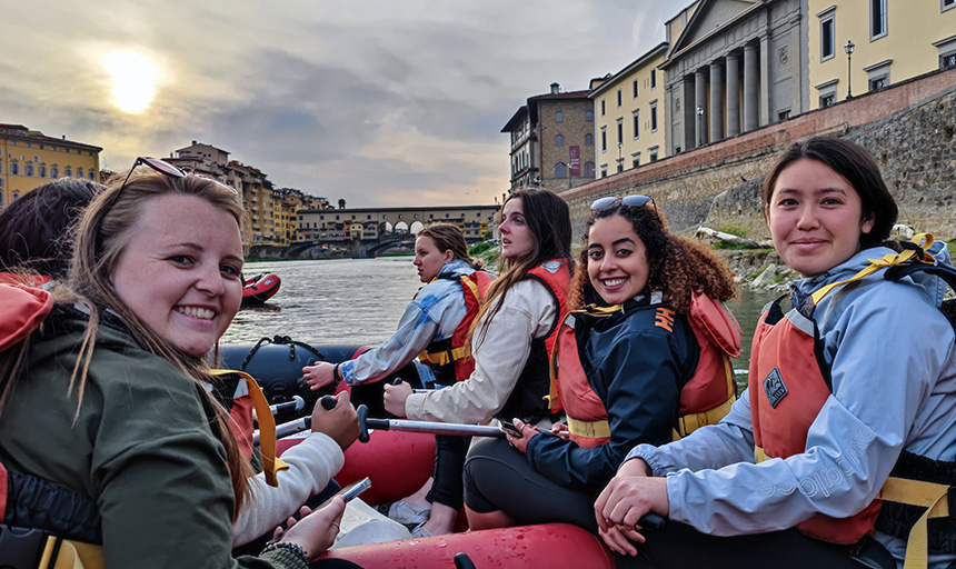 Students boating down a canal during a study away trip