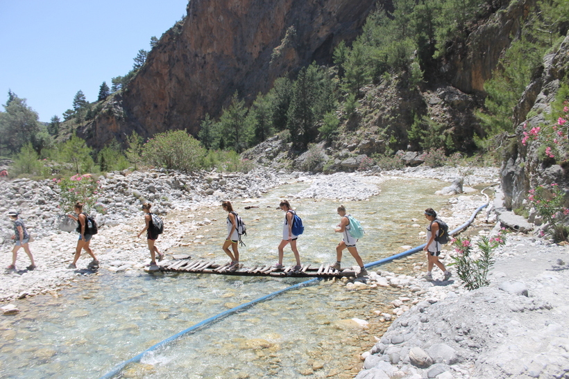 Students crossing a river