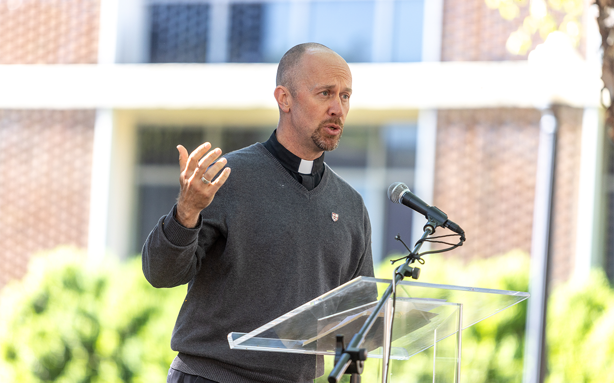 Roanoke College Chaplain Chris Bowen gestures while giving a blessing during the ceremony