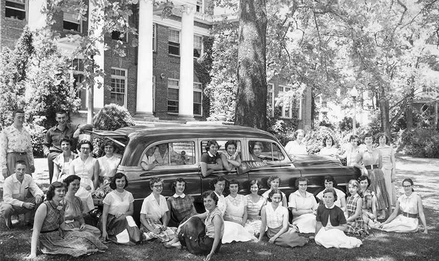 Students gathered around a car at Marion College