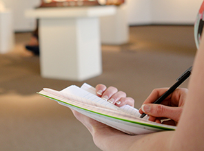 Student taking notes