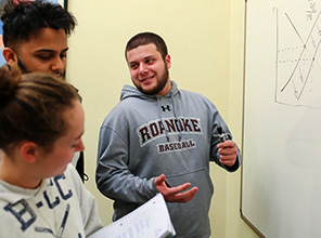 RC student, Kevin, collaberating with his group on a project