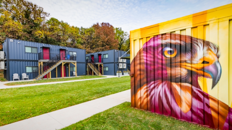 Residence hall buildings including a building painted in vivid colors with the image of a hawk