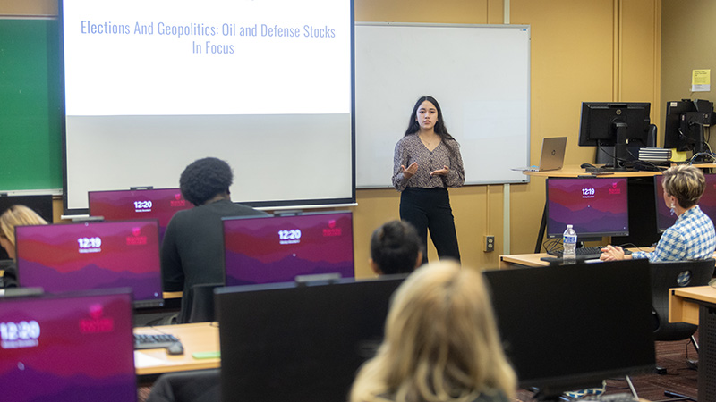 student giving a presentation at the front of class
