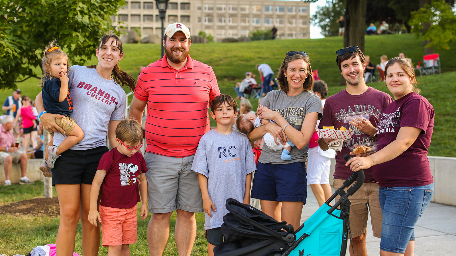 A group of alumni and their families at Elmwood Park