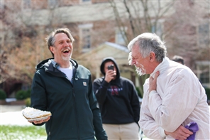 faculty pushing pie in each other's faces