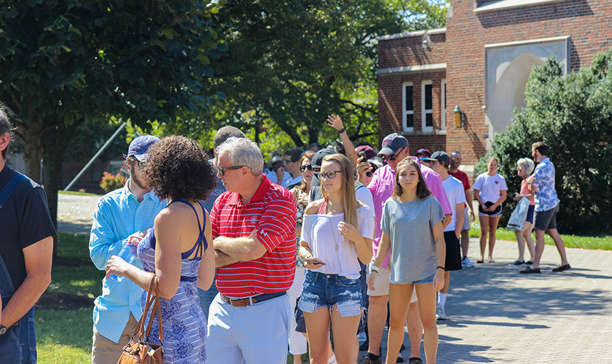 people standing in line at family weekend