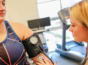 Student taking blood pressure