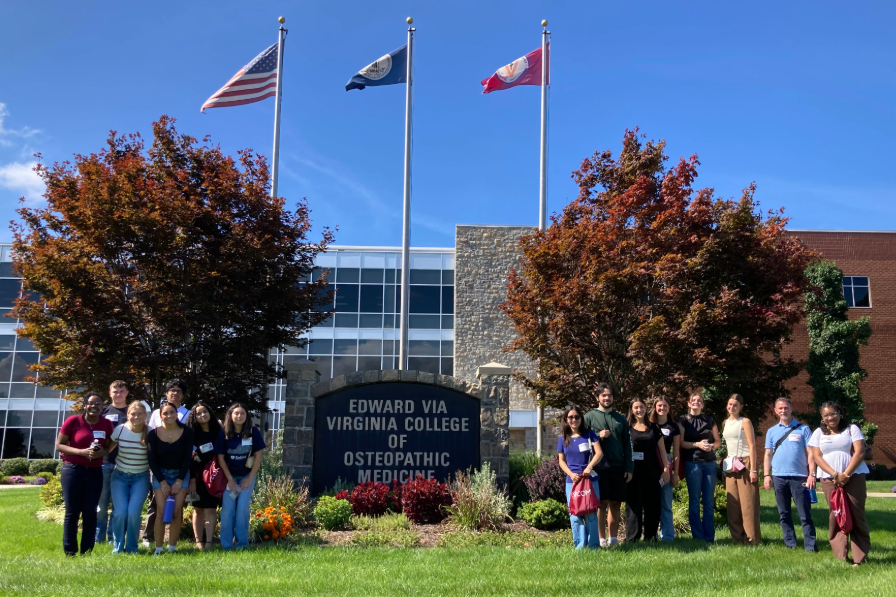Students smiling for a photo at a medical school