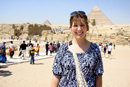 student posing by a pyramid