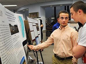 a student presenting his work to another student