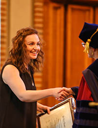 stephanie spector accepting an award