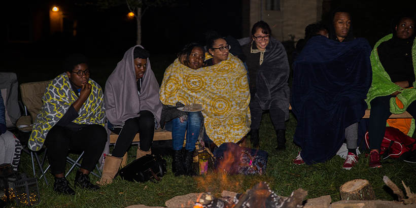 Students at the bonfire with Joseph McGill