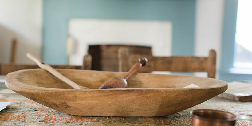 A bowl and spoon on the table in the renovated slave quarters