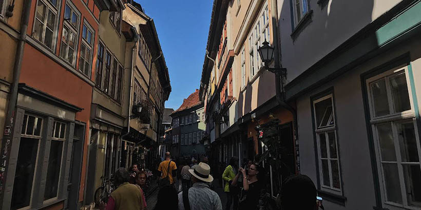 A long street with tall buildings on either side