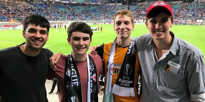 Four students at a soccer game