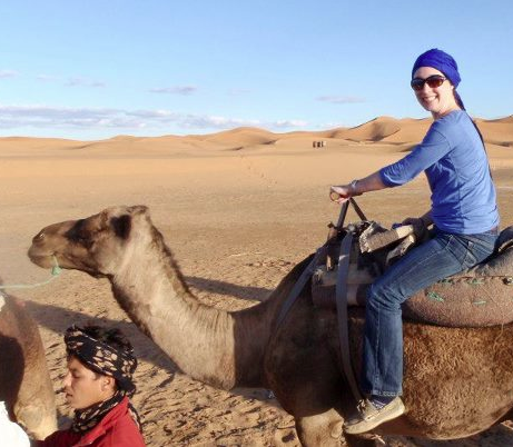 Katie Thornton riding a camel