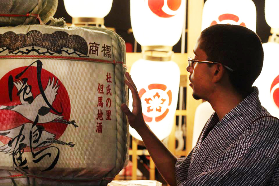 Man looking at paper lanterns