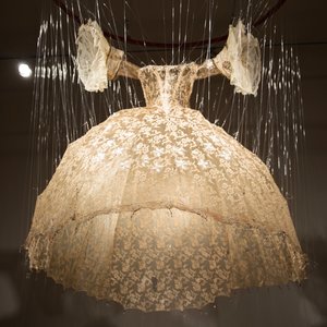 A ball gown hanging from the ceiling