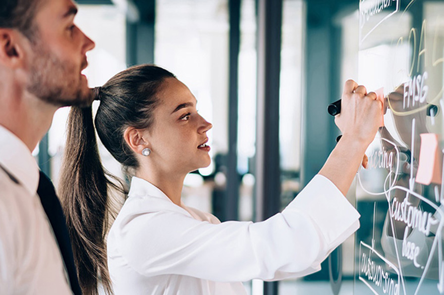 Women writing on board