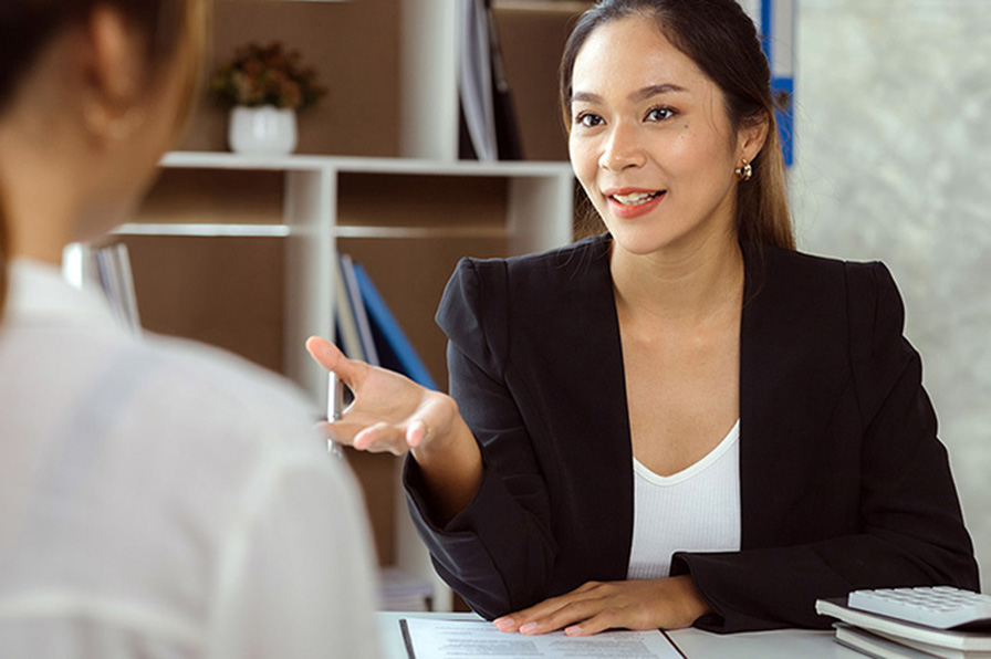 Women talking to figure