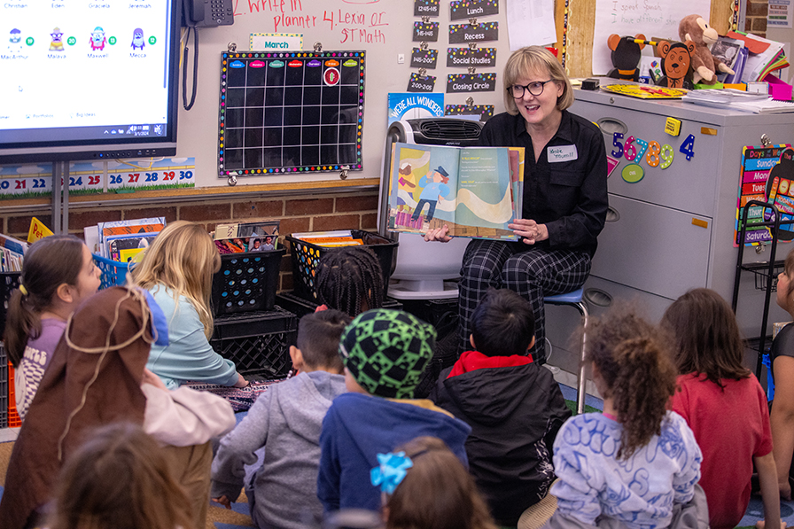 teacher in a classroom with students