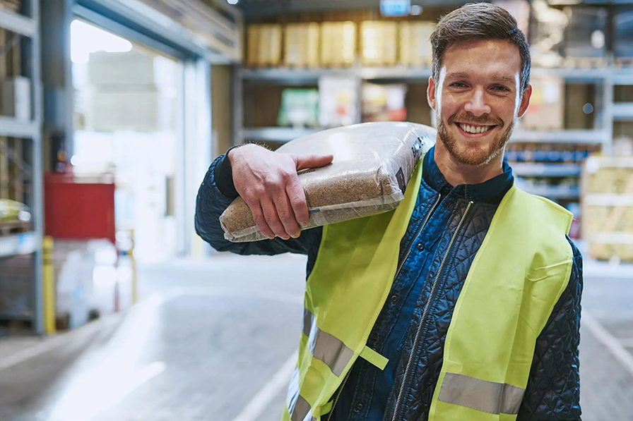 construction worker holding a bag over his shoulder