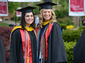 graduates posing for a photo