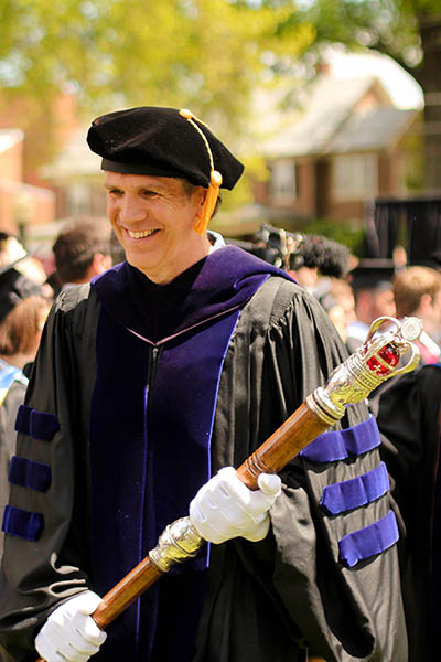 college mace being carried at commencement