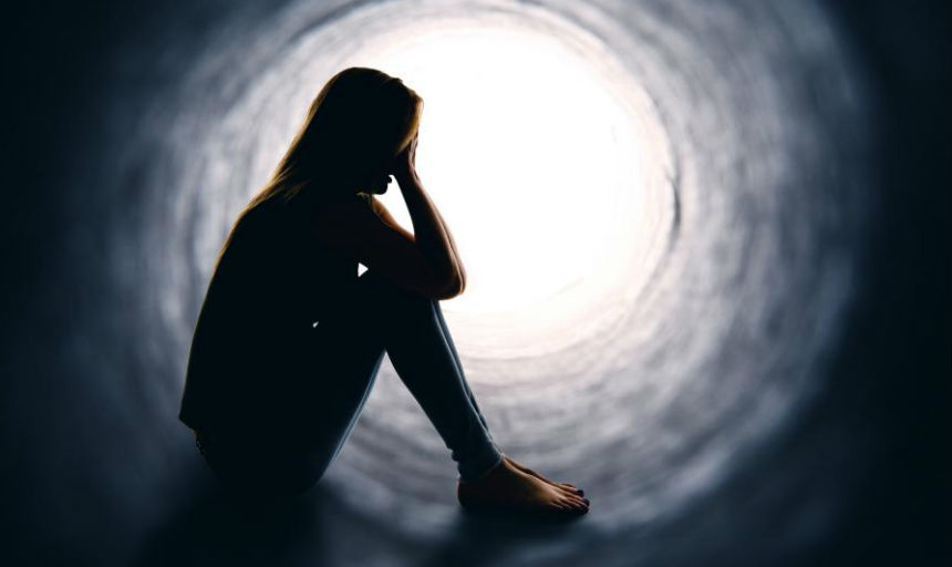 depressed woman in tunnel