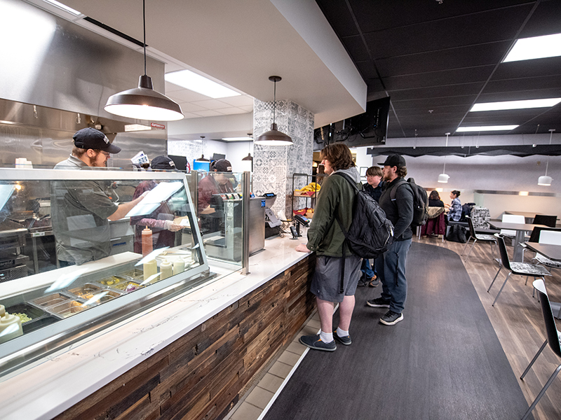 students ordering at the cavern