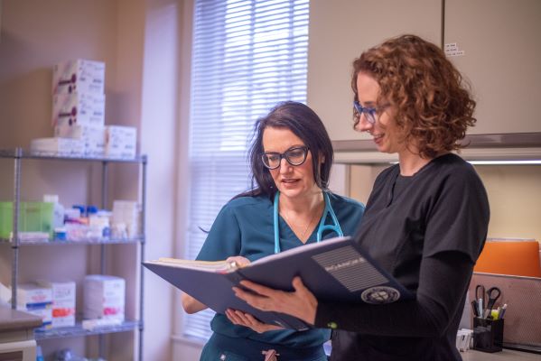 Health Staff Going Over Notes