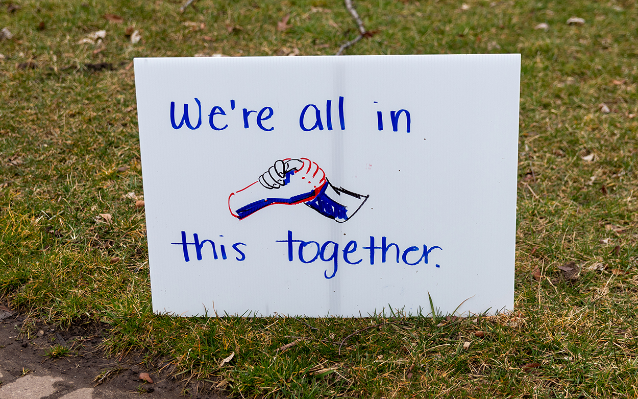 "we're all in this together" sign