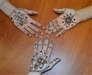 students with henna tattoos on their hands