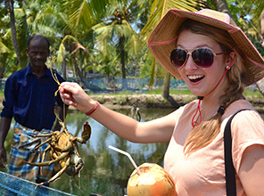 Student holding up a crab on a study abroad trip