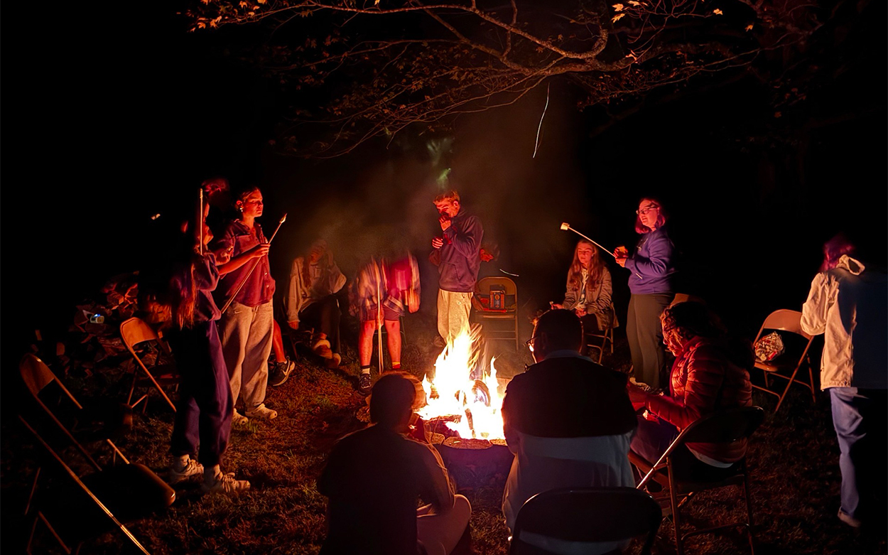 Students around a campfire