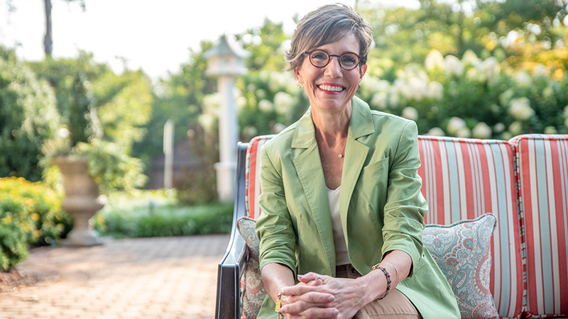 Kelly Shushok pictured on an outdoor patio