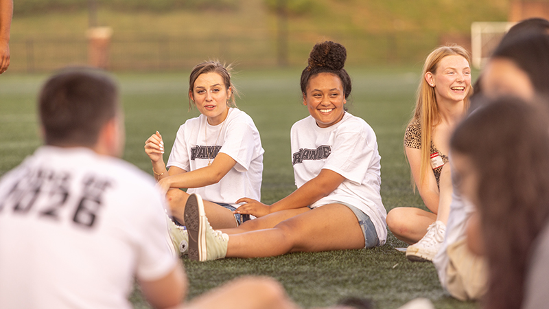 Students hanging out outdoors on the Maroon Athletic Quad