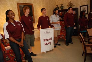 students holding a banner for the historical society