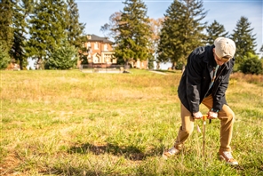 student doing a soil core