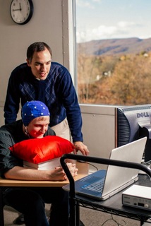 Student working with professor on an experiment