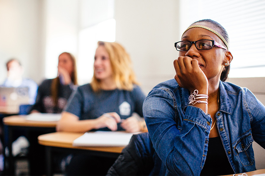 students listening in a classroom