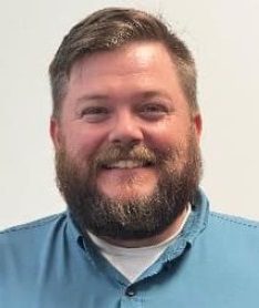 Bearded man in a blue shirt