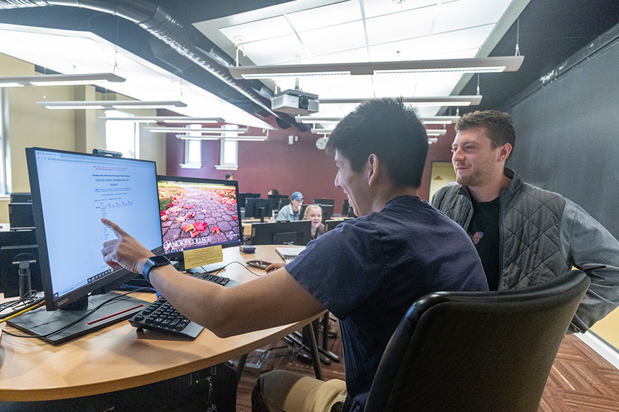 students reviewing data on a computer