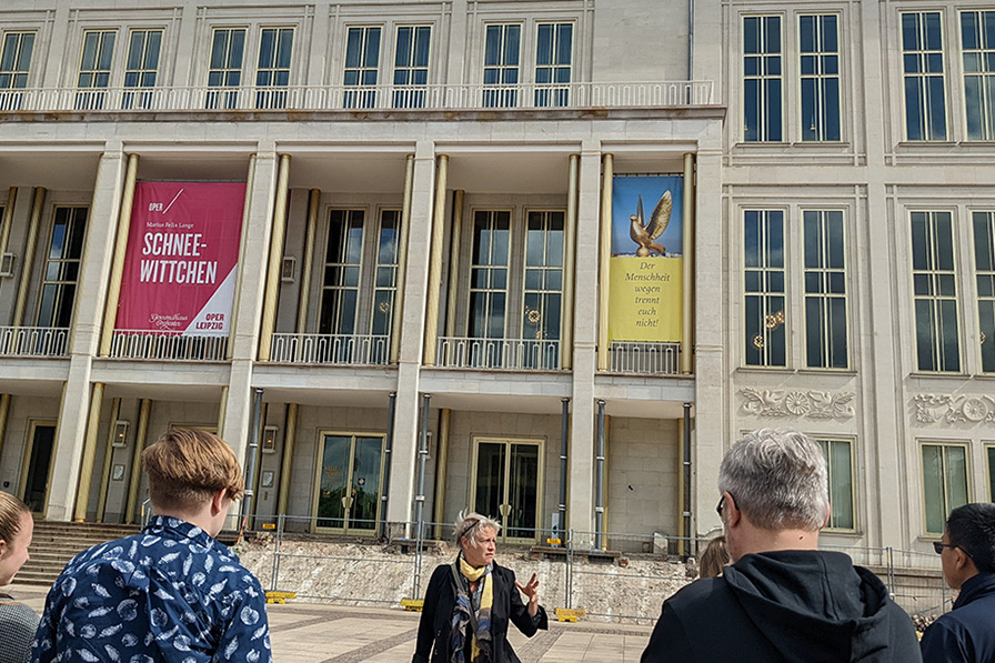 students and professor prepare to enter a museum in Germany