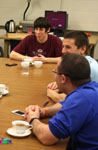 Students talking together at a table