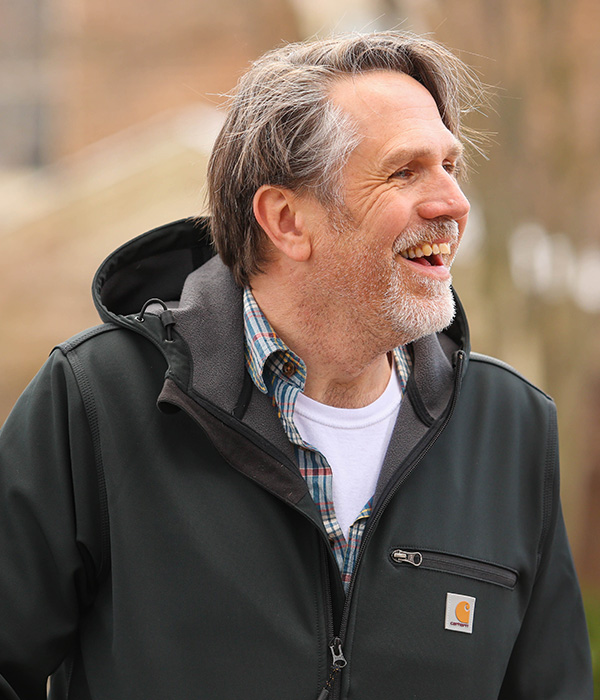 Prof. Lee smiling during a campus event