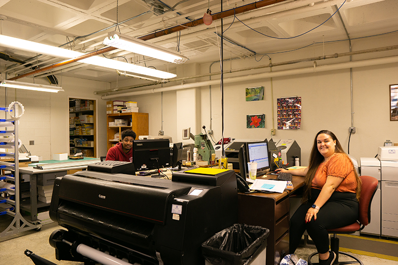 Student working in an office on campus